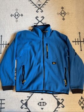 REI Men's Blue Fleece Jacket with Black Trim and Yellow Zipper Pulls